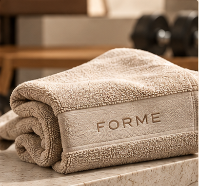 FORME premium gym towel in cream with embroidered logo